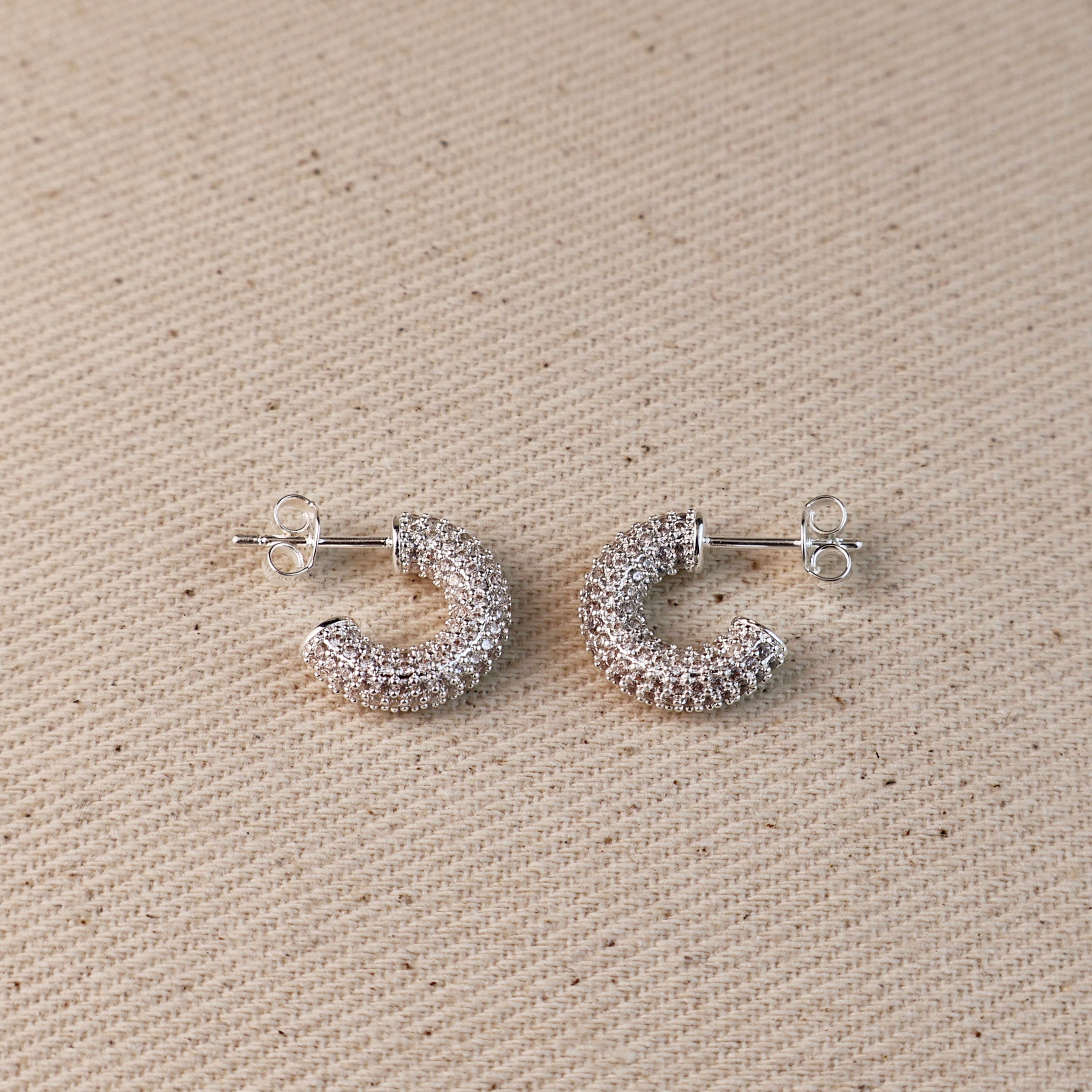 C-Shaped Iced Out Earrings with Micro CZ Stones – Luxury Statement Hoops.