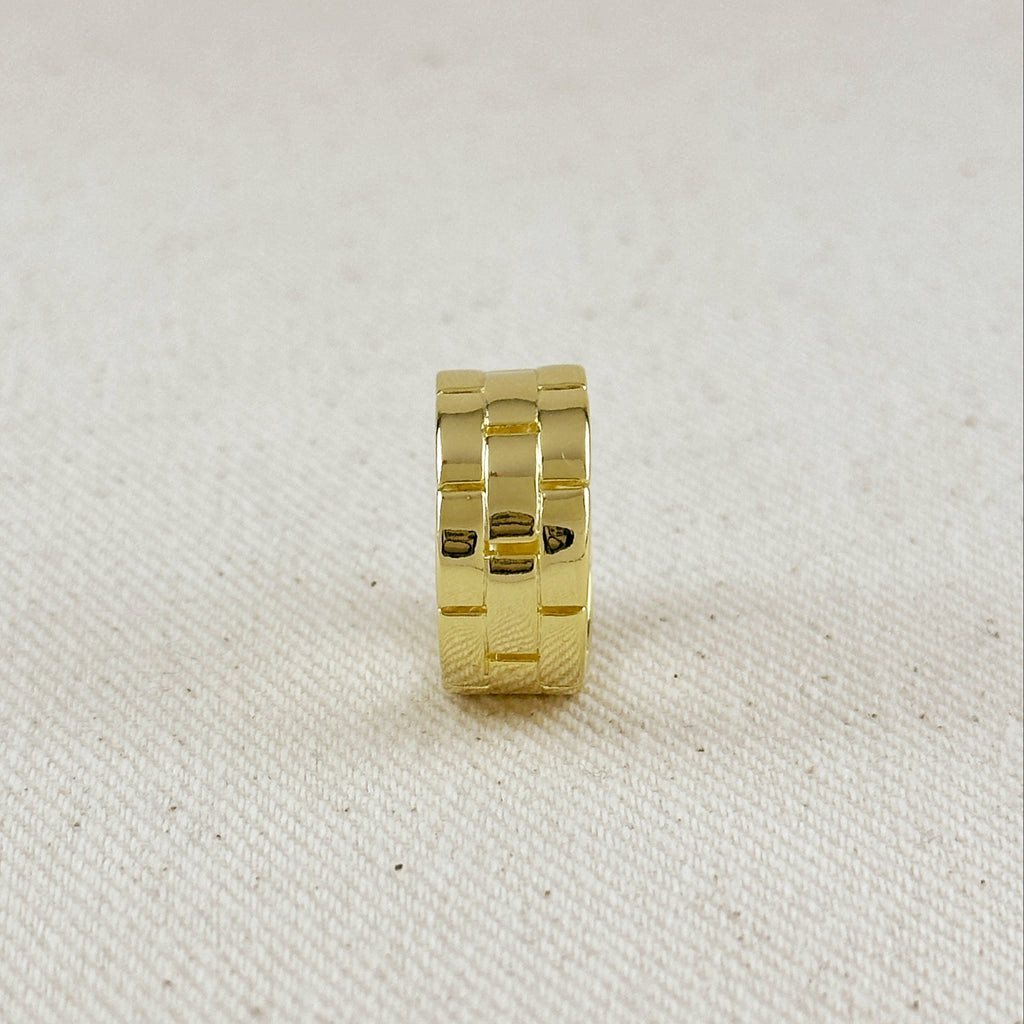 Gold ring on a textured beige background