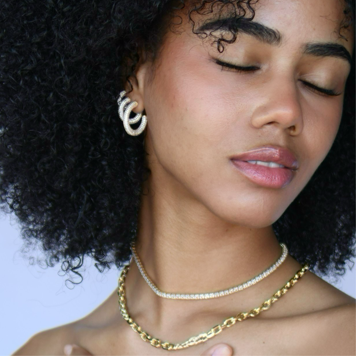 C-Shaped Iced Out Earrings with Micro CZ Stones – Luxury Statement Hoops.