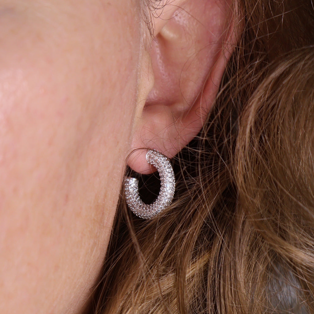 C-Shaped Iced Out Earrings with Micro CZ Stones – Luxury Statement Hoops.