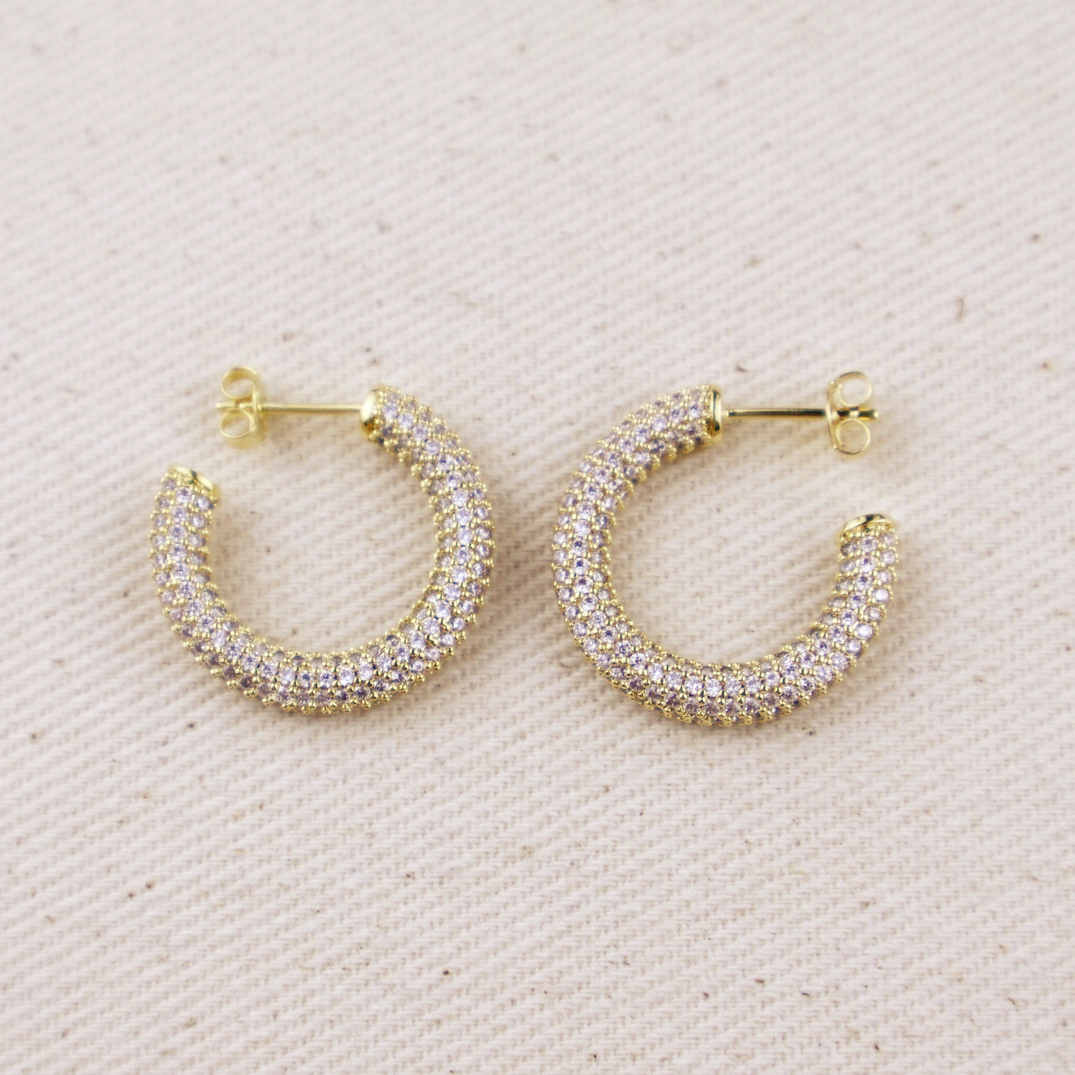 C-Shaped Iced Out Earrings with Micro CZ Stones – Luxury Statement Hoops.