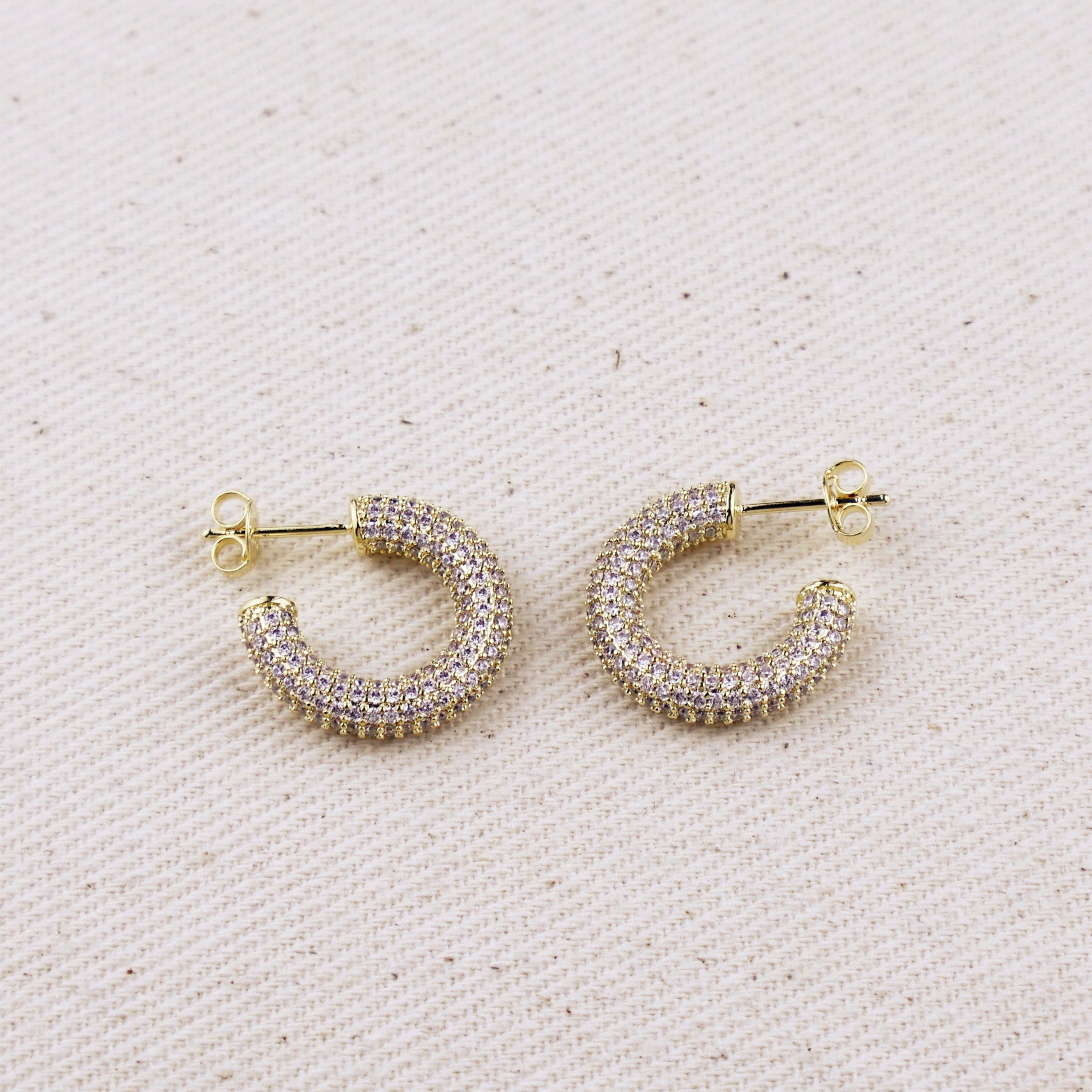 C-Shaped Iced Out Earrings with Micro CZ Stones – Luxury Statement Hoops.