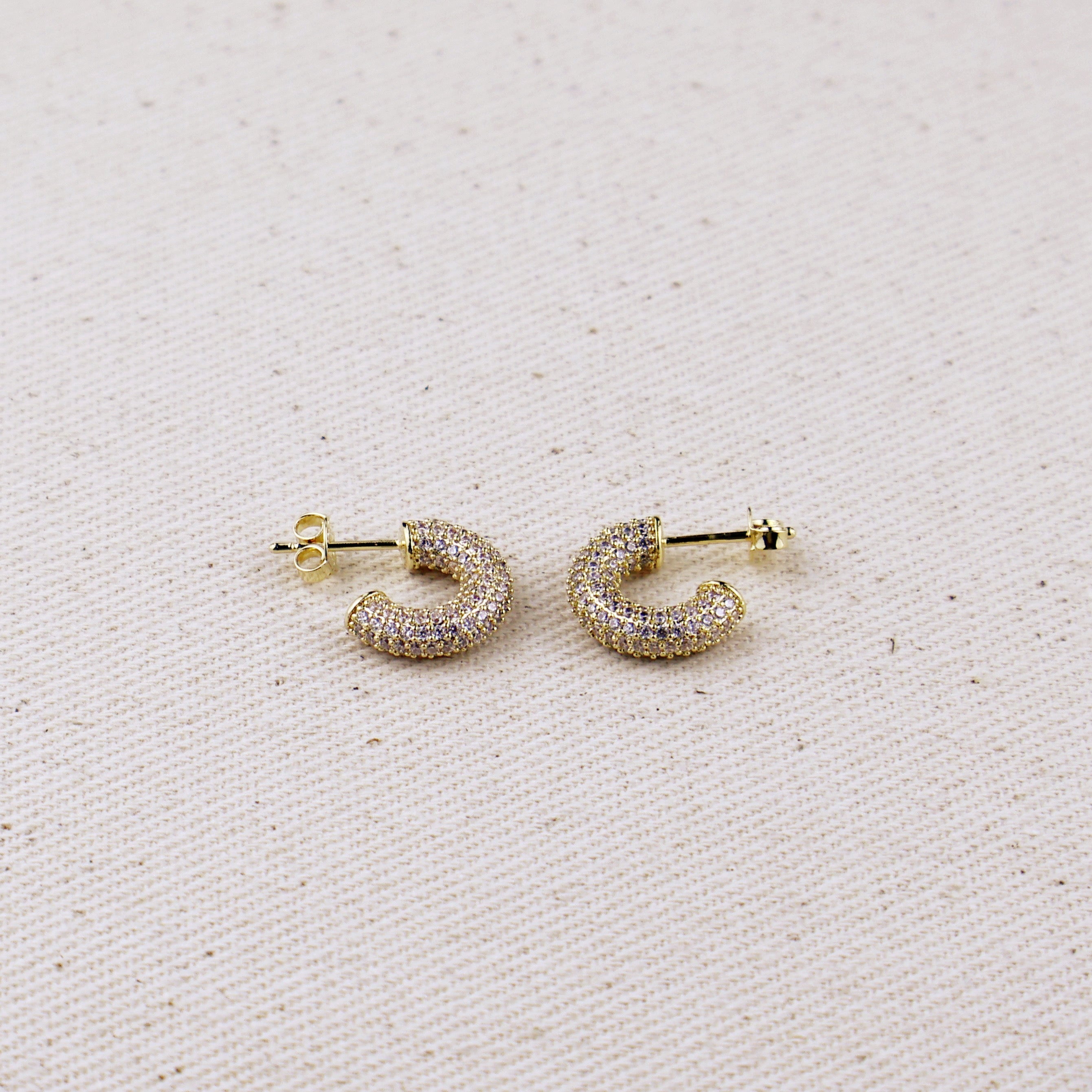 C-Shaped Iced Out Earrings with Micro CZ Stones – Luxury Statement Hoops.